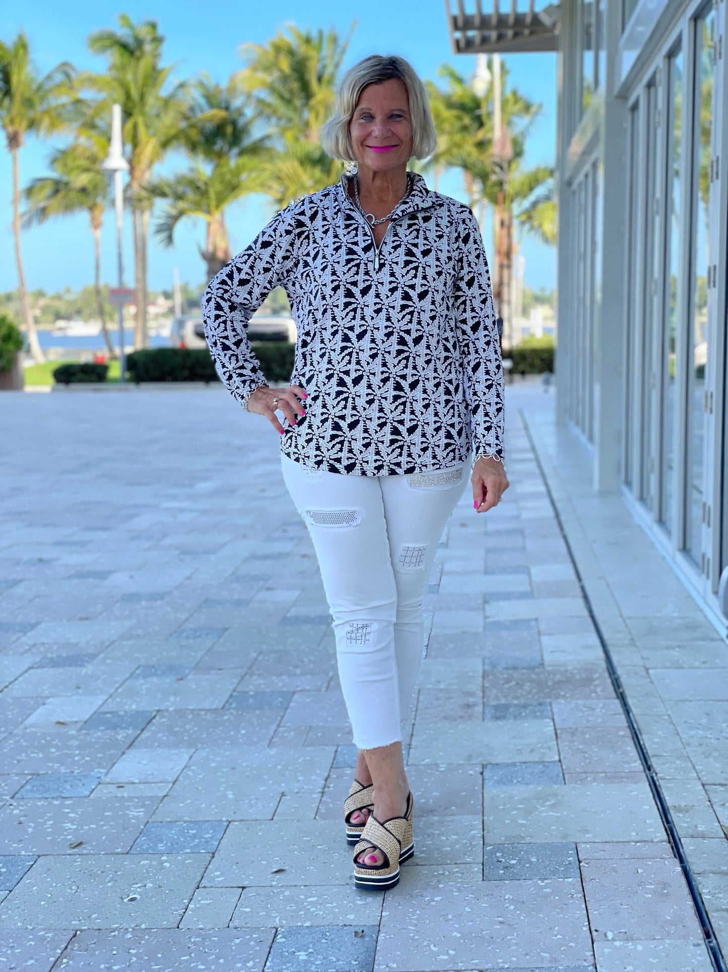 BLACK AND BEIGE PALM ZIPPER TOP