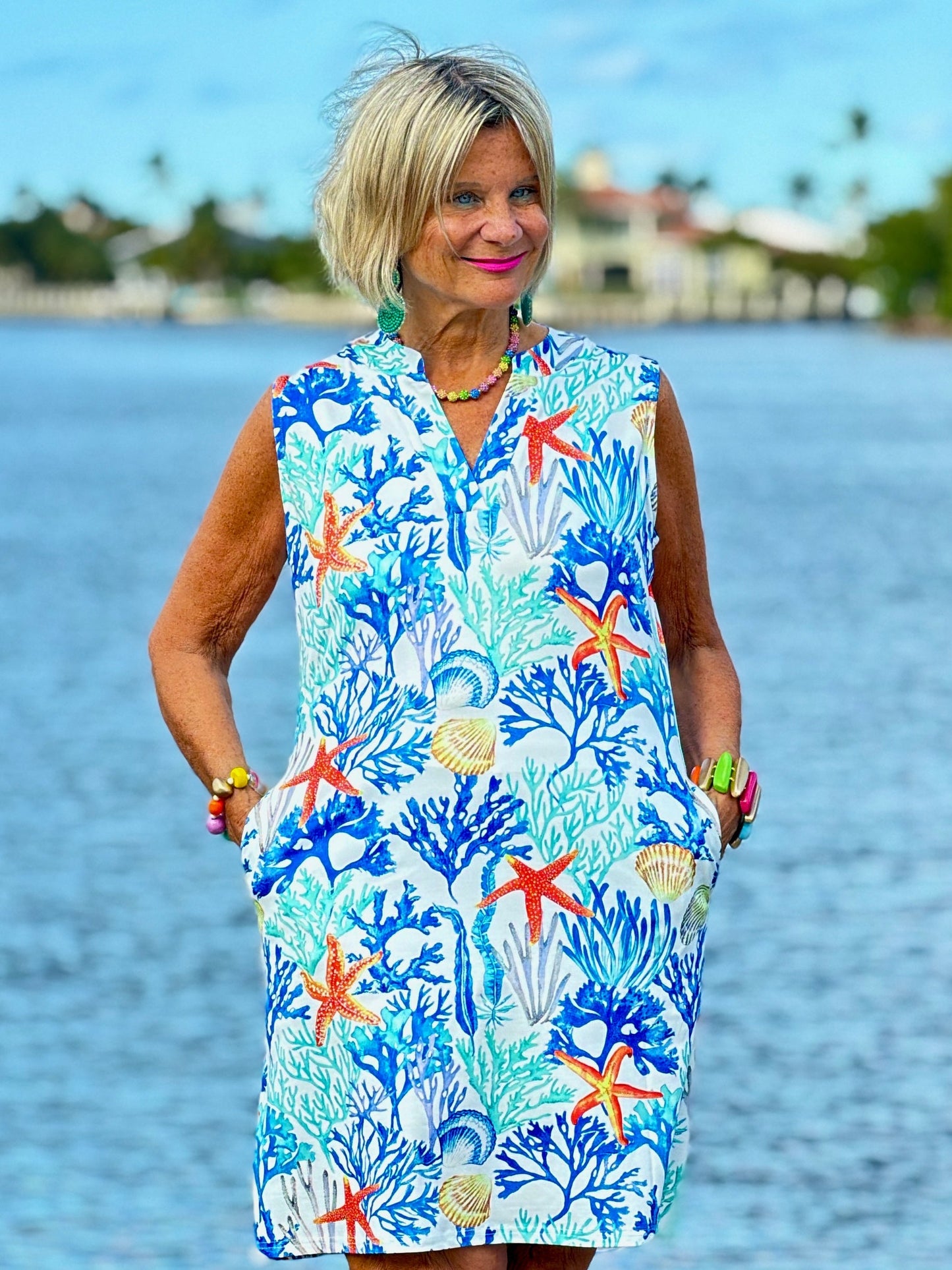 CORAL NOTCH SLEEVELESS UPF + 50 DRESS