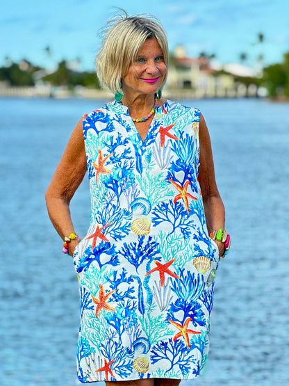 CORAL NOTCH SLEEVELESS UPF + 50 DRESS