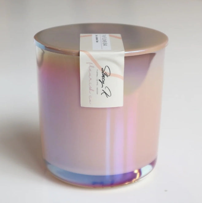 An iridescent candle by fleurish co and stacy k floral.