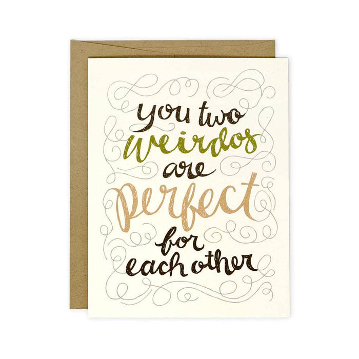 A cream card with with abstract lines and text that reads "you two weirdos are perfect for each other".